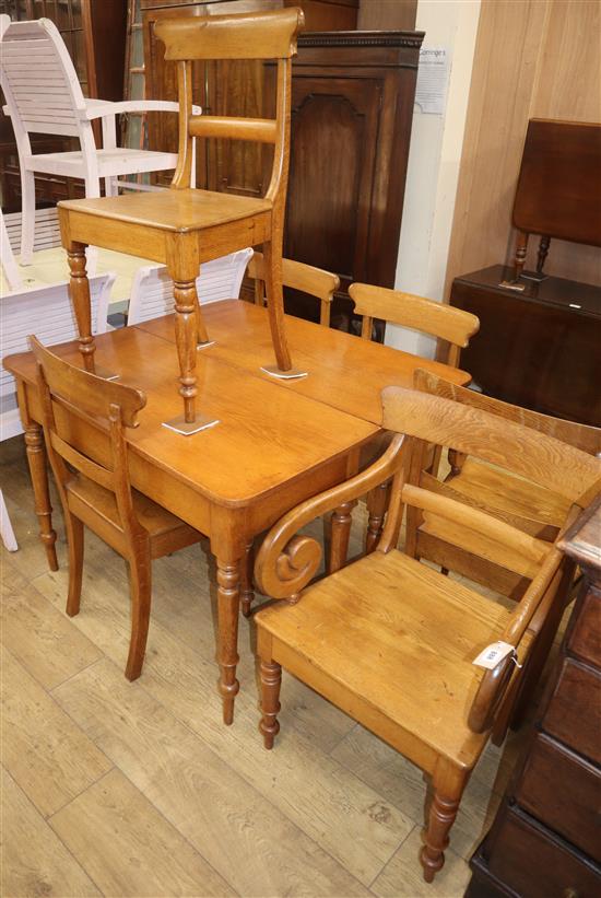 An early Victorian oak drop leaf table and six chairs W.104cm